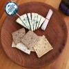 Cheeseboard featuring grain crackers and blue cheese